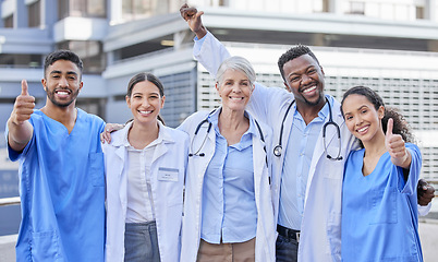 Image showing Doctor team, city and thumbs up with hug and celebration for healthcare and wellness work. Hospital, nursing and happy clinic group with success and support together with smile, motivation and trust