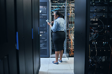 Image showing Woman, server room and engineer with a tablet for programming, system upgrade or cable maintenance. Black female technician in datacenter for network, software download or cybersecurity with IT app