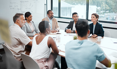 Image showing Business people, meeting and strategy in corporate planning, brainstorming or team discussion at the office. Group of employees in teamwork, collaboration or communication in conference at workplace