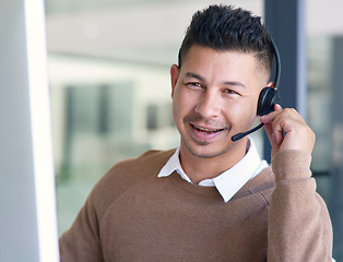 Image showing Man in portrait, callcenter with CRM and contact us, communication with headset and phone call in office. Male consultant in customer service, telemarketing or tech support with help desk job