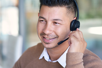 Image showing Man, face and callcenter with CRM and contact us, communication with headset and phone call in office. Male consultant smile in customer service, telemarketing or tech support with help desk job