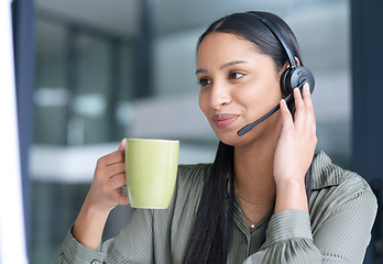 Image showing Woman with coffee, call center with CRM and contact us, communication with headset and technology in office. Female consultant with drink, customer service or telemarketing with help desk job