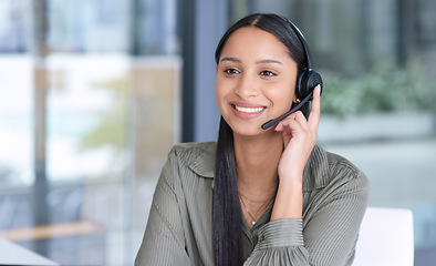 Image showing Woman with smile, callcenter with CRM and contact us, communication with headset and phone call in office. Female consultant in customer service, telemarketing or tech support with help desk job