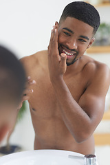 Image showing Happy man, face and beauty with mirror and skincare, hygiene and grooming during morning routine at home. Black male person smile in bathroom, fresh and clean facial with wellness and moisturizing