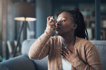 Image showing Asthma attack, medicine and a woman with inhaler to breathe in a house for health and wellness. Anxiety of a sick black person with medication for healthcare, lungs or chest and respiratory problem