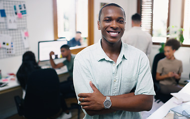 Image showing Black man, happy and portrait of designer with arms crossed in office workplace for business. Face, confidence and graphic design, African male person and entrepreneur, professional and leadership.