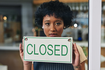 Image showing Sad woman, portrait and closed sign on window at cafe in small business, bankruptcy or out of service. Female person or restaurant waitress holding billboard for fail or debt at coffee shop or store