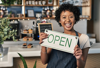 Image showing Happy woman, open sign and portrait of waitress at cafe in small business, morning or ready to serve. Female person, restaurant owner or server holding board for coffee shop or cafeteria opening