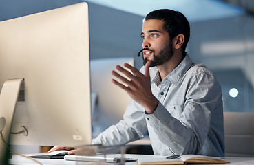 Image showing Call center, man and talking at computer for customer service, telemarketing sales and CRM consulting at night. Male agent, desktop pc and communication for advice, questions and technical support