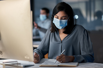 Image showing Call center, woman and notes at computer with mask for customer service, sales consulting and CRM in office. Female agent, consultant and virus protection in telemarketing agency for administration