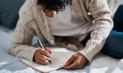 Image showing Notebook, bed and man with home planning, brainstorming and studying notes, education and mental health. Journal, goals and person writing in bedroom for learning, planner and schedule or reminder