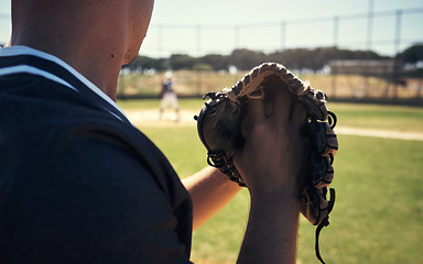 Image showing Pitch, glove and hands of man on baseball field for competition, training and games. Action, exercise and championship with male athlete throwing in stadium park for fitness, closeup and sports club