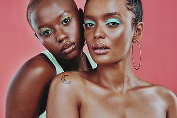 Image showing Makeup art, women together and portrait in studio, beauty or cosmetic for diverse friends by background. Creative black woman, model girl and neon color for support, skin glow or futuristic aesthetic