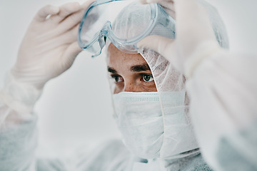 Image showing Man with face mask, goggles and safety from Covid, health policy and protection suit with disinfection. Crisis, healthcare compliance and male medical professional in PPE to protect against corona