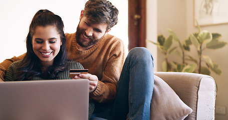 Image showing Young couple, credit card and online shopping with virtual wallet or ecommerce or order and sitting on couch at home. Smiling, woman and man using banking service or make secure internet payment