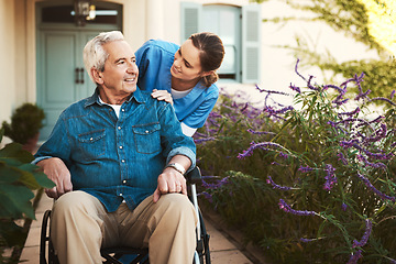 Image showing Senior man, nurse and wheelchair in elderly care, talking or healthcare support at nursing home. Happy mature male and woman caregiver walking patient, person with a disability in retirement outdoors