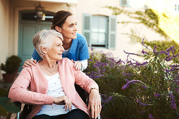 Image showing Senior woman, wheelchair and nurse in elderly care, support or garden walk at nursing home. Happy mature female and caregiver helping patient or person with a disability for healthcare outdoors