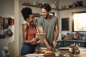 Image showing Interracial couple, tablet and cooking in kitchen for recipe, social media or online food vlog at home. Man and woman preparing breakfast meal or cutting ingredients together with technology on table