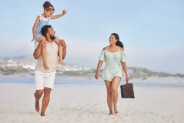 Image showing Picnic, parents or kid walking on beach to relax as a happy family on fun summer holiday vacation together. Lovely dad, mother or excited young girl bonding, smiling or holding basket at seashore