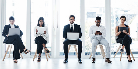 Image showing Group, business people and chair with tech in recruitment queue, diversity or waiting room for hr. Men, women and technology for interview, human resources and research for hiring, job or opportunity