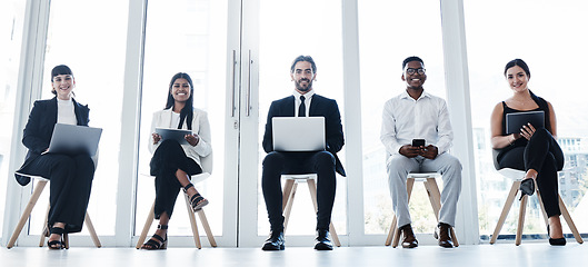 Image showing Line, group portrait and people in waiting room with technology and diversity at interview in office. Happy faces, hiring of men and women with business team online for recruitment or human resources