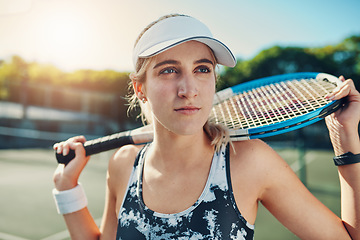 Image showing Tennis, court and woman thinking outdoor for fitness, training or cardio routine on blurred background. Face, exercise and athletic sports lady with racket for challenge, match or competitive mindset