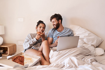 Image showing Home bedroom, pizza and happy couple relax, laugh and eating fast food, takeout meal and watch online movie. Happiness, laptop or comfortable people smile, bond and enjoy quality time together on bed