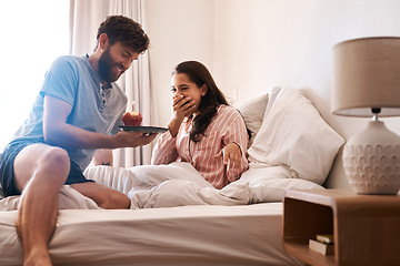 Image showing Couple, bedroom and surprise birthday candle, cupcake or celebration dessert for excited woman shocked over food gift. Muffin, wow and people smile, happiness and celebrate special day on home bed