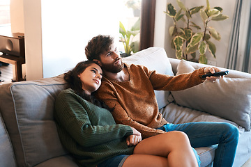 Image showing Love, home and relax couple watching tv show, subscription movie or streaming entertainment in living room. Bond, media remote or marriage people watch television, film or video in apartment lounge