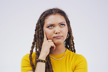 Image showing Doubt, confused and gen z girl thinking in studio on mockup, space and white background. Choice, problem solving and female model decide, puzzled face and unsure of decision or option and idea emoji