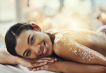 Image showing Happy woman, back or portrait at spa in salt scrub for cosmetics treatment, skincare and massage at resort. Face of female person relax on bed for exfoliation, beauty therapy and wellness at salon