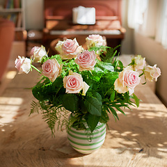 Image showing Closeup of bouquet of pink roses in a vase, flowers and nature on living room table, gift for romance or friendship. Plant, botanical and symbol of love, natural and floral arrangement at home