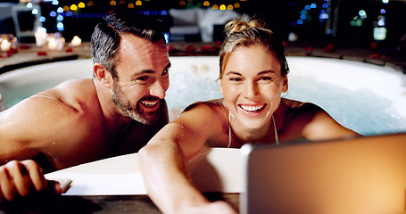Image showing Tablet, selfie and couple in hot tub at spa for holiday, romantic vacation and weekend getaway. Water, marriage and man and woman take picture for social media on honeymoon, anniversary and relax