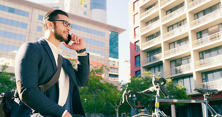 Image showing Business man, phone call and bicycle in city to travel with eco friendly transport. Cellphone, bike and male professional thinking on urban street while talking, speaking and discussion on smartphone