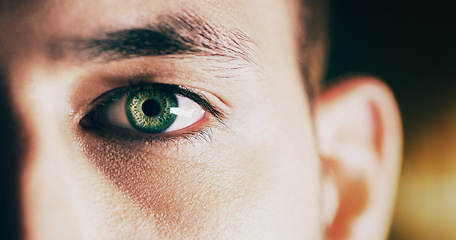 Image showing Portrait, eye and man with clear vision, future or eyelash .with focus against studio background. Face, male person or model with sight, see or awareness with zoom, retina or futuristic with closeup