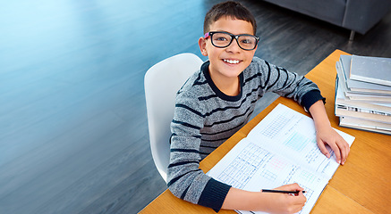 Image showing Happy boy, student and portrait with book for studying, learning or education in math at home on mockup. Smart little kid or child and smile for mathematics, textbook or problem solving on study desk