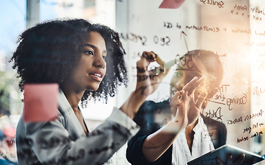 Image showing Problem solving, writing and women in business meeting planning schedule, calendar or strategy in office. Teamwork, goal and people in collaboration for brainstorming, innovation or solution on glass