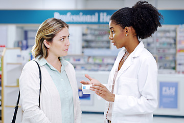 Image showing Pharmacy, medicine and pharmacist help woman with pills, assistance and medical advice in drugstore. Healthcare, shopping or female worker consulting customer for product, prescription and medication