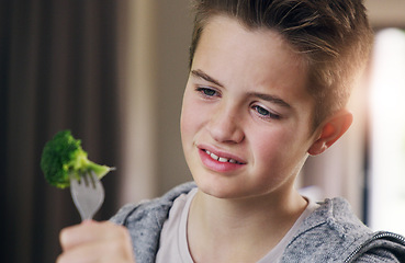 Image showing Disgust, food and dislike with child and broccoli for nutrition, health and cooking. Sad, angry and dinner with boy and refuse to eat vegetable at home for eating problem, frustrated and fear