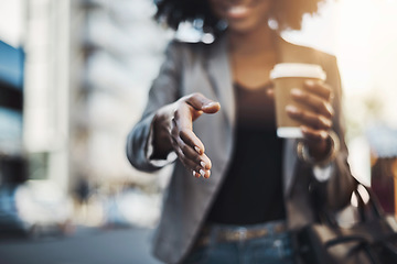 Image showing Woman, handshake and meeting in city for greeting, introduction or hiring with coffee outdoors. Hand of female shaking hands for b2b, collaboration or agreement in deal or recruitment in urban town