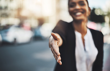 Image showing Happy woman, handshake and meeting in city for partnership, introduction or greeting outdoors. Hand of female shaking hands for b2b, collaboration or agreement in deal or hiring in urban town street