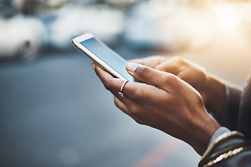 Image showing Woman, hands and phone in city for communication, social media or texting on street sidewalk outdoors. Hand of female chatting on mobile smartphone for networking, online browsing or travel in town