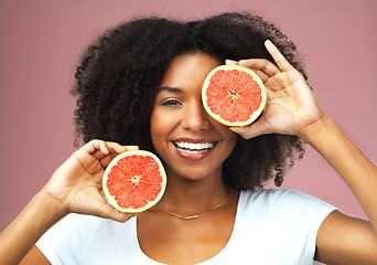 Image showing Grapefruit, smile and face portrait of black woman in studio isolated on a pink background. Natural, fruit and African female model with vegan nutrition, vitamin c or healthy diet, food or wellness.