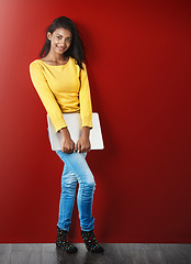 Image showing Student woman, portrait and laptop by wall with smile for learning, education or research for development. Gen z gIrl, computer and happy for study, elearning and social network app by red background