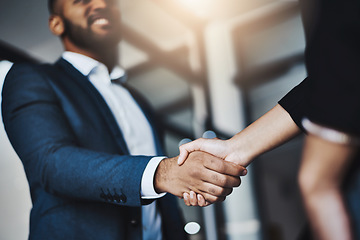 Image showing Hand shake, man and woman with low angle in office for welcome, b2b agreement and onboarding with smile. Businessman, partnership and kindness in human resources, hiring or team building in workplace