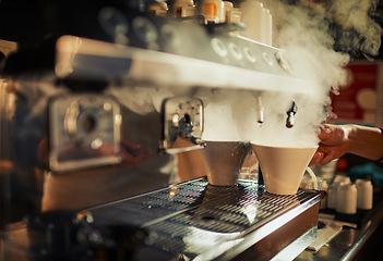 Image showing Coffee machine, steam and hands of cafe person, barista or diner waiter making beverage, latte drink or espresso. Tea cup, commerce market shop and restaurant store server with morning hot chocolate