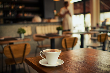 Image showing Wooden table, coffee shop mug and cafe store, restaurant or diner for commerce beverage, drink or retail shopping service. Tea cup, morning espresso or startup small business for fresh caffeine sales