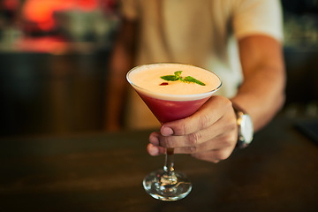 Image showing Fruit cocktail glass, hands and bartender with alcohol at pub, night club or drinks bar for restaurant service. Nightclub diner, liquid drink and hands of waiter with drink or beverage for person