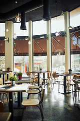 Image showing Empty restaurant cafe, diner or coffee shop for retail services, hospitality industry or sales service. Interior design decor, bistro store and trendy small business with furniture, chair and table