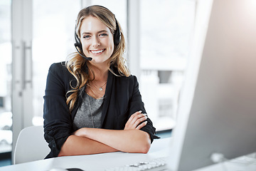 Image showing Happy woman, callcenter and arms crossed in portrait, contact us with communication and CRM. Customer service, phone call and female consultant with headset and smile, help desk and tech support